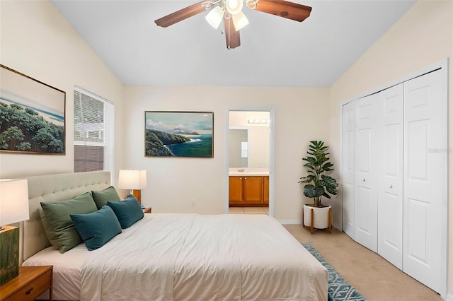 910 Sheeler Oaks Dr, Apopka, FL 32703 - bedroom with vaulted ceiling, light colored carpet, a closet, ensuite bath, and a ceiling fan