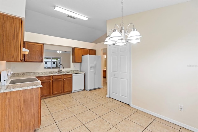 910 Sheeler Oaks Dr, Apopka, FL 32703 - kitchen featuring white appliances, lofted ceiling, a sink, a chandelier, and brown cabinets