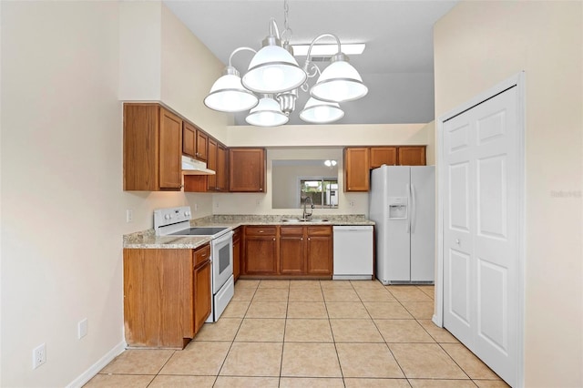 910 Sheeler Oaks Dr, Apopka, FL 32703 - kitchen featuring white appliances, a sink, brown cabinetry, light countertops, and a chandelier