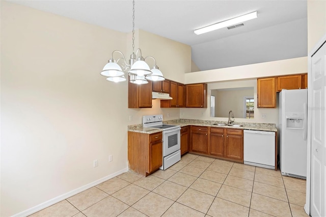 910 Sheeler Oaks Dr, Apopka, FL 32703 - kitchen with white appliances, a sink, under cabinet range hood, light countertops, and a chandelier