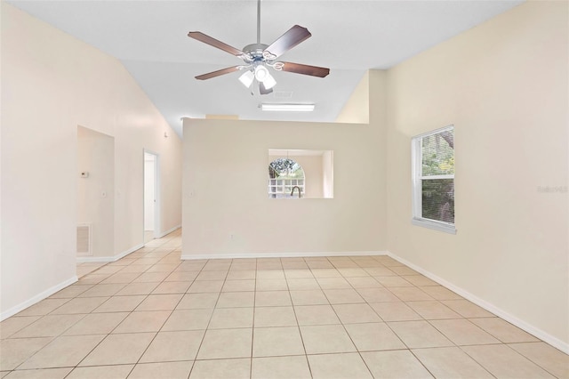 910 Sheeler Oaks Dr, Apopka, FL 32703 - spare room featuring a ceiling fan, high vaulted ceiling, light tile patterned floors, and baseboards