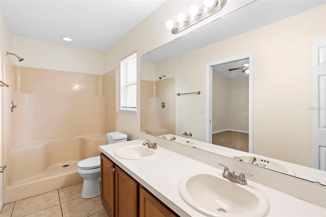 910 Sheeler Oaks Dr, Apopka, FL 32703 - full bathroom featuring a shower, double vanity, tile patterned flooring, and toilet