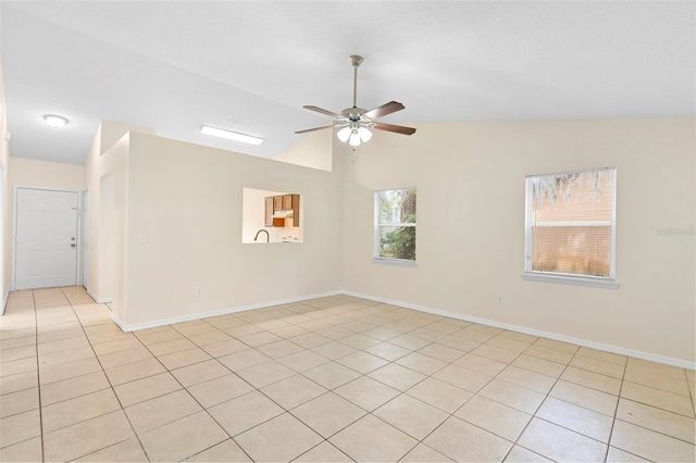 910 Sheeler Oaks Dr, Apopka, FL 32703 - empty room featuring light tile patterned floors, ceiling fan, vaulted ceiling, and baseboards