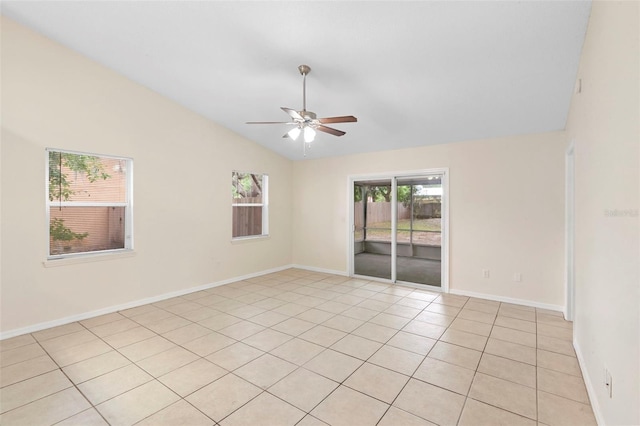 910 Sheeler Oaks Dr, Apopka, FL 32703 - spare room with vaulted ceiling, ceiling fan, baseboards, and light tile patterned flooring
