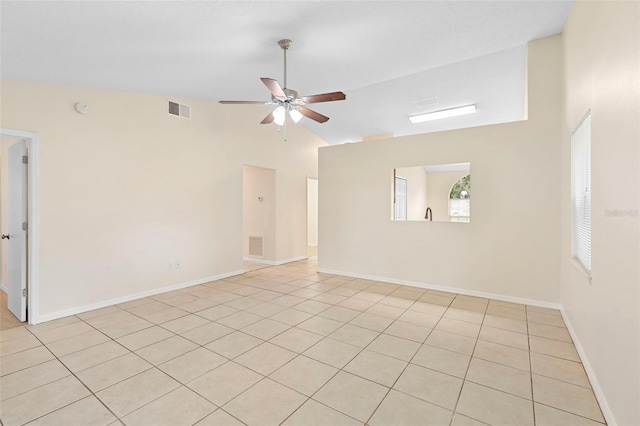 910 Sheeler Oaks Dr, Apopka, FL 32703 - empty room with ceiling fan, lofted ceiling, light tile patterned flooring, and baseboards