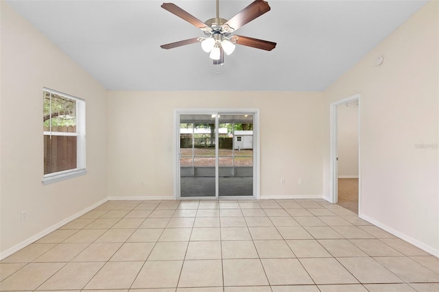 910 Sheeler Oaks Dr, Apopka, FL 32703 - spare room featuring vaulted ceiling, ceiling fan, baseboards, and light tile patterned floors