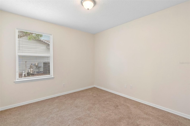 910 Sheeler Oaks Dr, Apopka, FL 32703 - carpeted spare room featuring baseboards and a textured ceiling