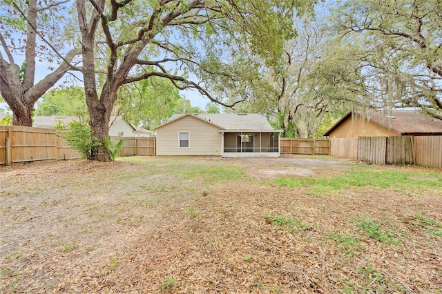 910 Sheeler Oaks Dr, Apopka, FL 32703 - back of house featuring a sunroom and a fenced backyard