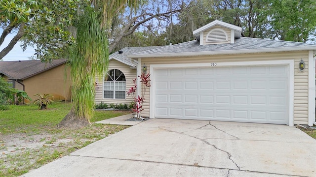 910 Sheeler Oaks Dr, Apopka, FL 32703 - view of front of home featuring driveway, an attached garage, and a shingled roof