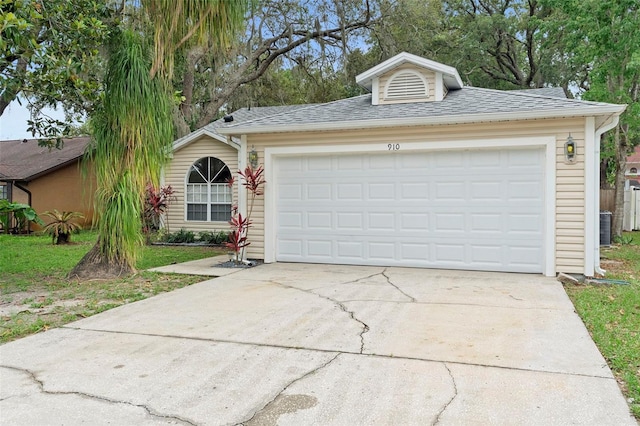 910 Sheeler Oaks Dr, Apopka, FL 32703 - view of front of property featuring concrete driveway, an attached garage, and a shingled roof