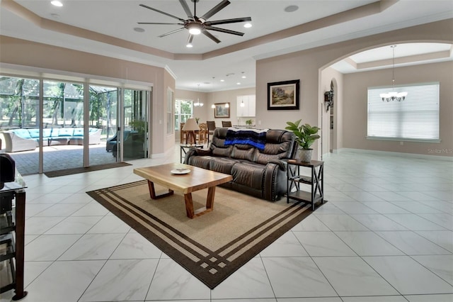 171 Birchmont Dr, Deland, FL 32724 - living area with a raised ceiling, a chandelier, arched walkways, ceiling fan, and recessed lighting