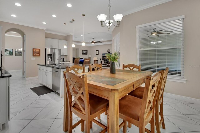 171 Birchmont Dr, Deland, FL 32724 - dining area featuring a ceiling fan, recessed lighting, crown molding, arched walkways, and baseboards