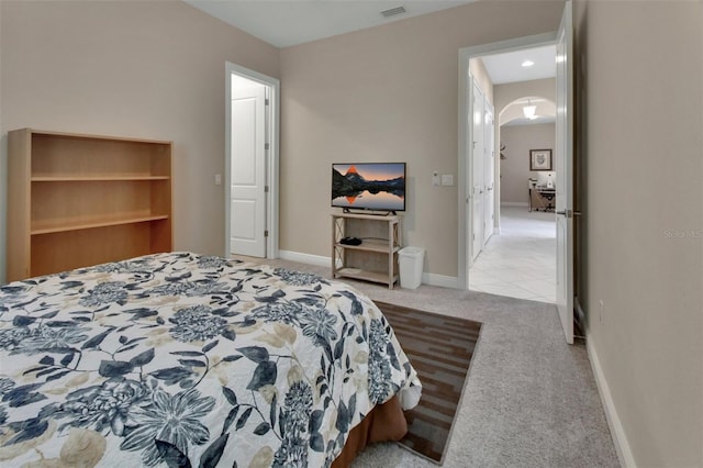 171 Birchmont Dr, Deland, FL 32724 - bedroom featuring arched walkways, carpet flooring, and baseboards