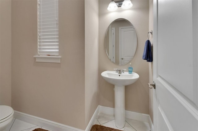 171 Birchmont Dr, Deland, FL 32724 - half bath with toilet, tile patterned flooring, and baseboards