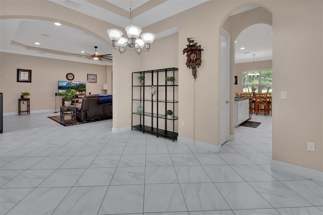 171 Birchmont Dr, Deland, FL 32724 - interior space with a ceiling fan, a chandelier, arched walkways, a raised ceiling, and recessed lighting