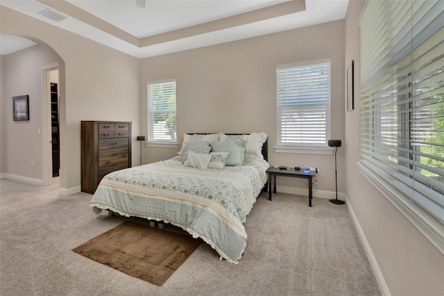 171 Birchmont Dr, Deland, FL 32724 - bedroom featuring carpet flooring, multiple windows, and arched walkways
