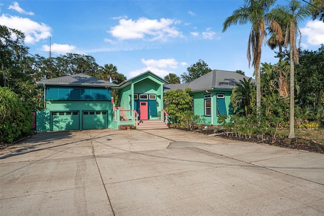 61 E Bayshore Dr, Port Orange, FL 32127 - view of front of house featuring driveway and a garage