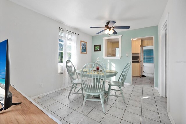 61 E Bayshore Dr, Port Orange, FL 32127 - dining room with ceiling fan, light tile patterned floors, and baseboards