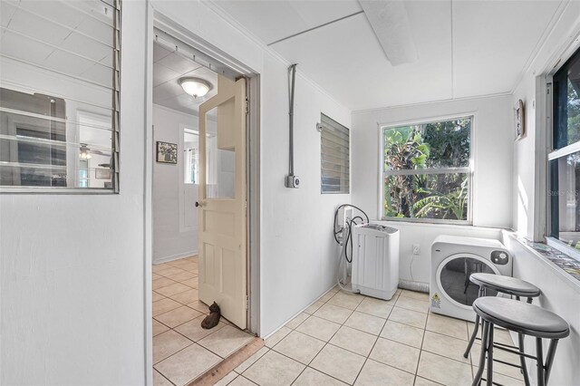 61 E Bayshore Dr, Port Orange, FL 32127 - washroom featuring light tile patterned floors, ac unit, ornamental molding, and washer and clothes dryer