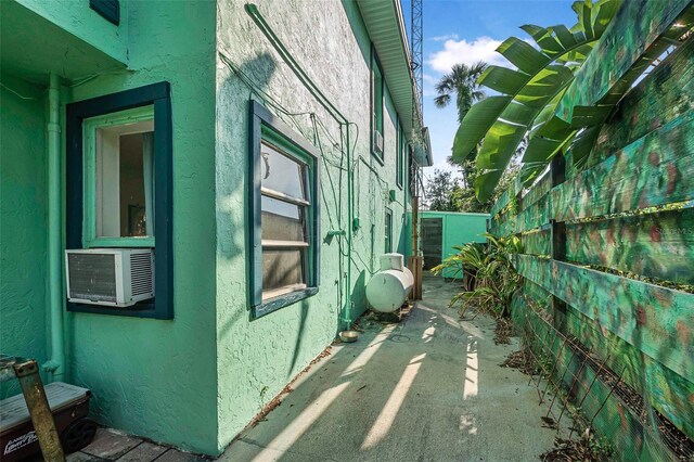 61 E Bayshore Dr, Port Orange, FL 32127 - view of property exterior featuring stucco siding and a patio