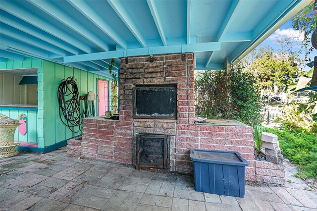 61 E Bayshore Dr, Port Orange, FL 32127 - view of patio / terrace with an outdoor brick fireplace