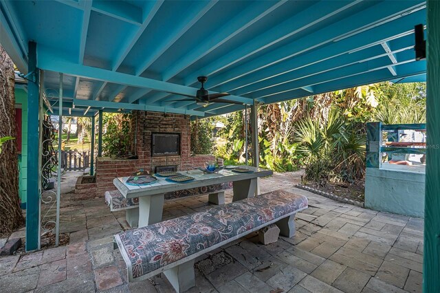 61 E Bayshore Dr, Port Orange, FL 32127 - view of patio / terrace featuring an outdoor brick fireplace and ceiling fan