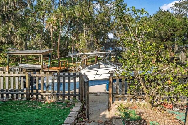 61 E Bayshore Dr, Port Orange, FL 32127 - view of yard featuring a dock
