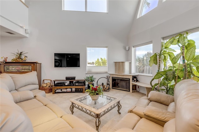 1209 N Atlantic Ave, New Smyrna Beach, FL 32169 - living area with a high ceiling, carpet flooring, and a premium fireplace