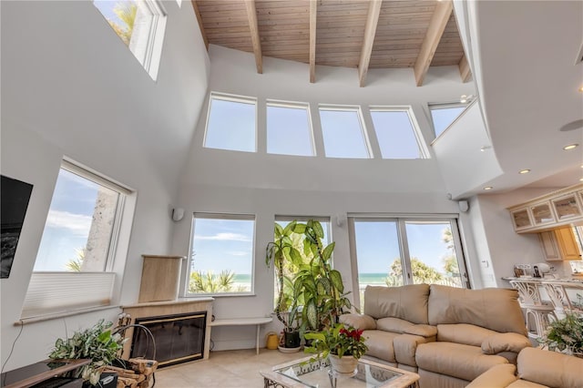 1209 N Atlantic Ave, New Smyrna Beach, FL 32169 - living room with a high ceiling, healthy amount of natural light, a premium fireplace, wood ceiling with exposed beams, and recessed lighting