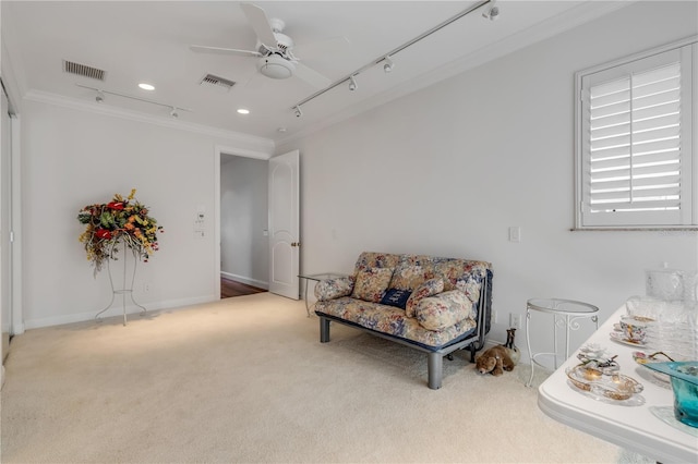 1209 N Atlantic Ave, New Smyrna Beach, FL 32169 - sitting room with ornamental molding, carpet floors, a ceiling fan, baseboards, and recessed lighting