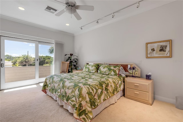 1209 N Atlantic Ave, New Smyrna Beach, FL 32169 - bedroom featuring access to exterior, track lighting, light colored carpet, recessed lighting, and crown molding