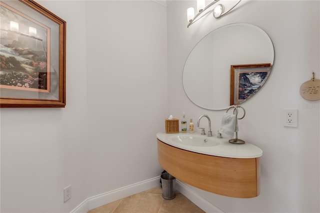 1209 N Atlantic Ave, New Smyrna Beach, FL 32169 - bathroom featuring tile patterned flooring, baseboards, and a sink