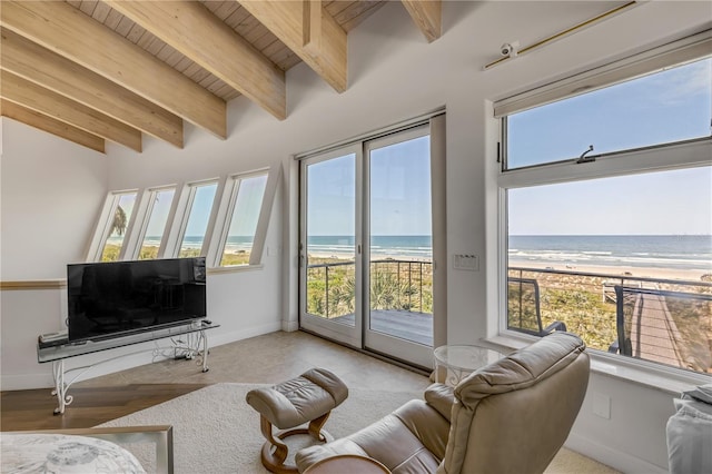1209 N Atlantic Ave, New Smyrna Beach, FL 32169 - living room featuring wooden ceiling with exposed beams, a view of the beach, and baseboards