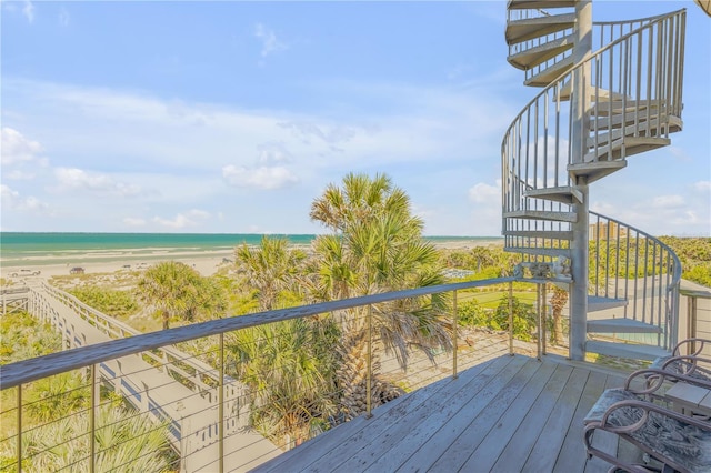 1209 N Atlantic Ave, New Smyrna Beach, FL 32169 - deck featuring stairway and view of water and beach