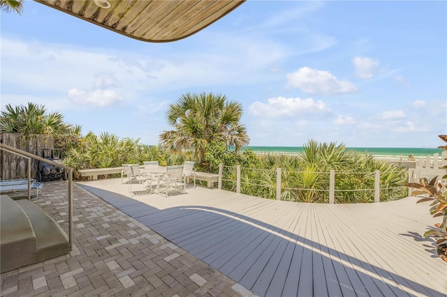 1209 N Atlantic Ave, New Smyrna Beach, FL 32169 - view of swimming pool with outdoor dining space, view of local beach, and a deck with water view