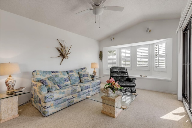 1209 N Atlantic Ave, New Smyrna Beach, FL 32169 - carpeted living room featuring lofted ceiling, ceiling fan, and a textured ceiling