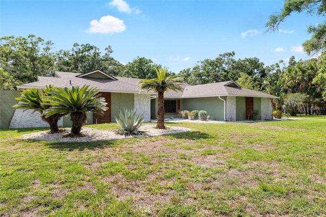 4301 Hudson Ln, Tampa, FL 33618 - view of front of property featuring a front lawn and stucco siding