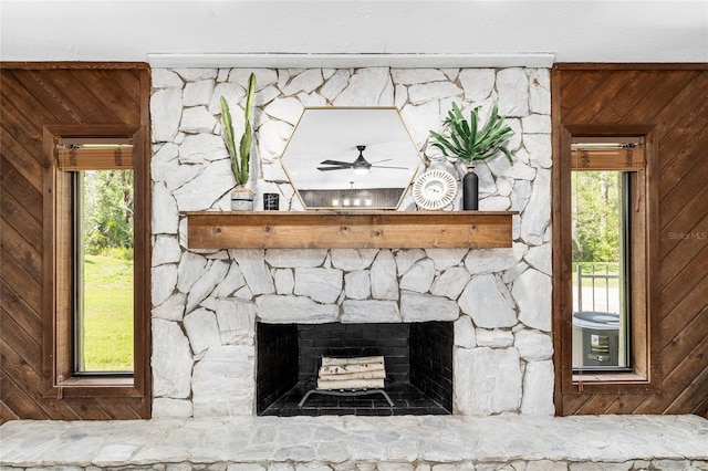 4301 Hudson Ln, Tampa, FL 33618 - detailed view of wooden walls, a fireplace, and ceiling fan