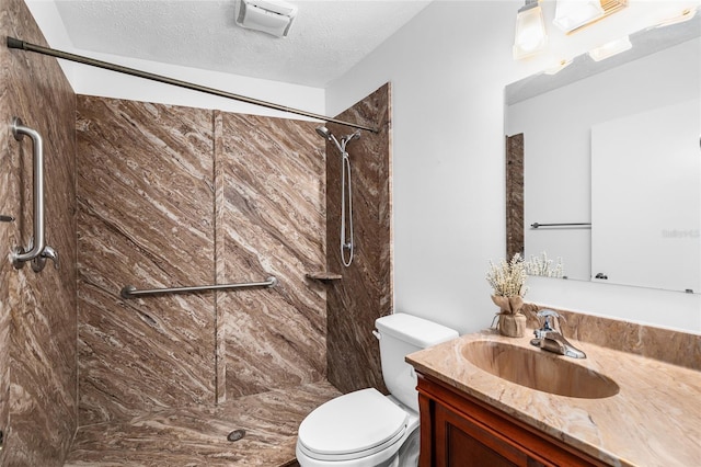 4301 Hudson Ln, Tampa, FL 33618 - full bathroom featuring toilet, vanity, a shower stall, and a textured ceiling