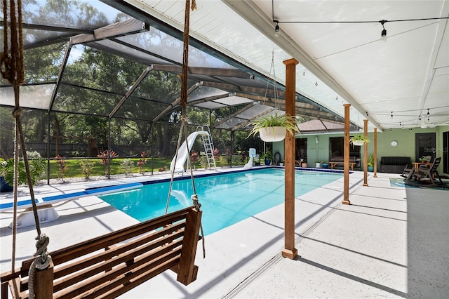 4301 Hudson Ln, Tampa, FL 33618 - outdoor pool with a patio area, a water slide, and glass enclosure