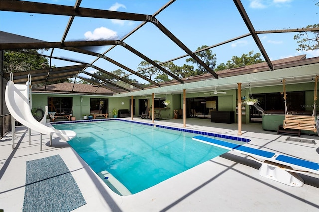 4301 Hudson Ln, Tampa, FL 33618 - swimming pool featuring a water slide, a patio, a diving board, an outdoor living space, and ceiling fan