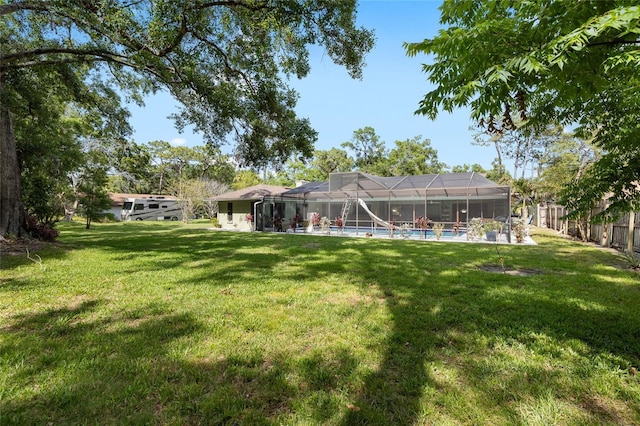 4301 Hudson Ln, Tampa, FL 33618 - view of yard with an outdoor pool and glass enclosure
