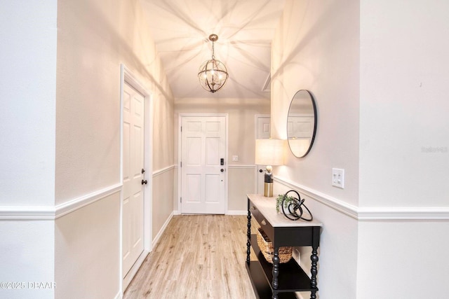 706 Fox Tail Ct, New Smyrna Beach, FL 32168 - foyer featuring a chandelier and light wood finished floors