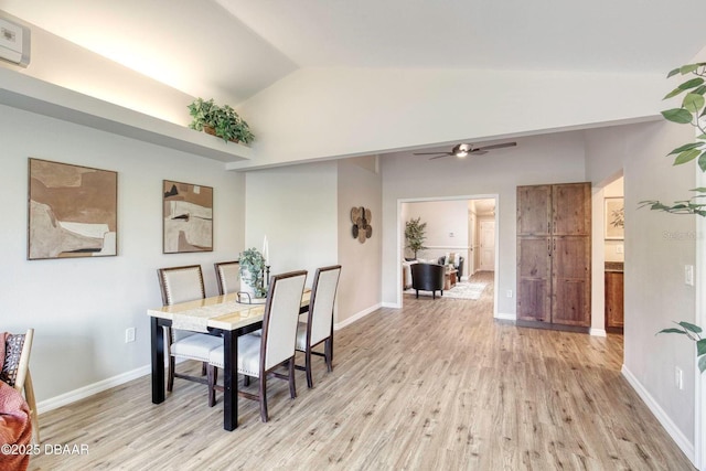 706 Fox Tail Ct, New Smyrna Beach, FL 32168 - dining space featuring light wood-type flooring, lofted ceiling, a ceiling fan, and baseboards