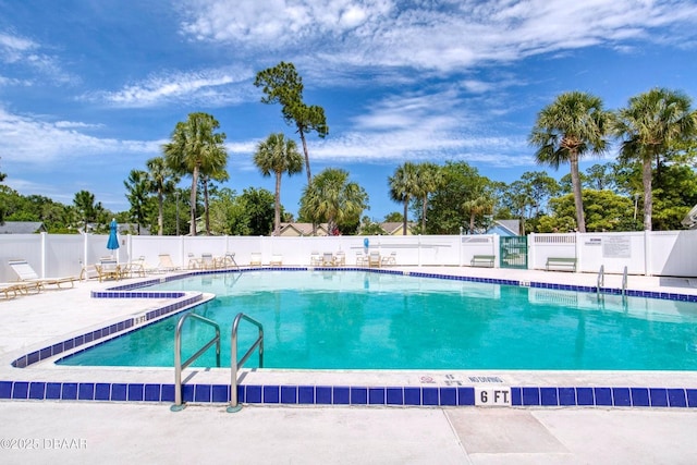 706 Fox Tail Ct, New Smyrna Beach, FL 32168 - community pool with a patio area