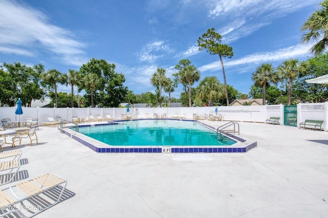 706 Fox Tail Ct, New Smyrna Beach, FL 32168 - community pool with a patio