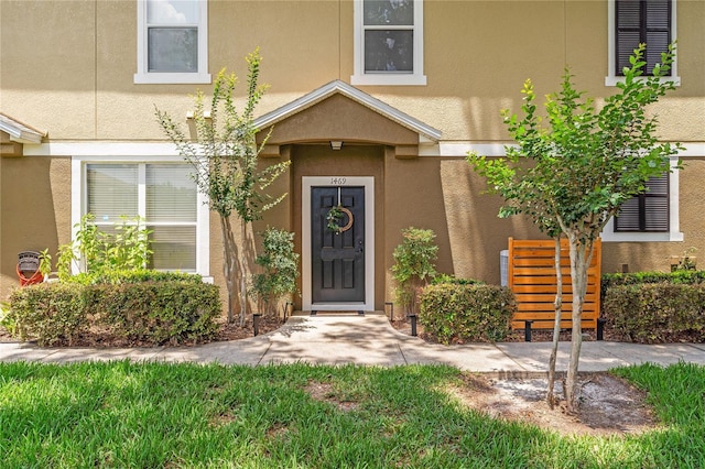 1469 Broken Oak Dr Unit 43A, Winter Garden, FL 34787 - view of exterior entry with stucco siding