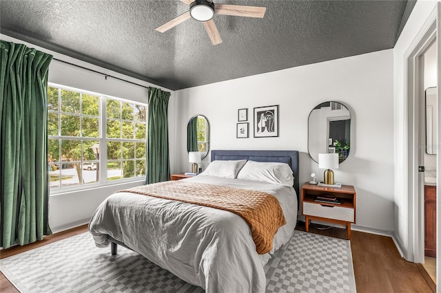 1469 Broken Oak Dr Unit 43A, Winter Garden, FL 34787 - bedroom featuring wood finished floors, a textured ceiling, and a ceiling fan