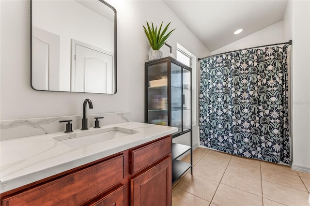 1469 Broken Oak Dr Unit 43A, Winter Garden, FL 34787 - full bath with vanity, tile patterned floors, vaulted ceiling, and a shower with curtain