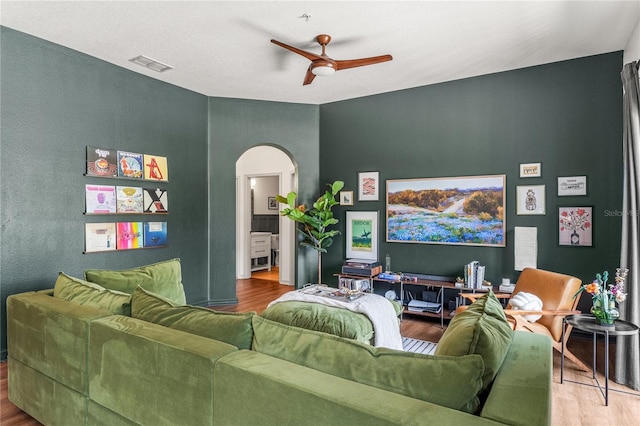 1469 Broken Oak Dr Unit 43A, Winter Garden, FL 34787 - living area featuring arched walkways, ceiling fan, and wood finished floors
